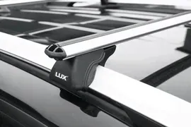 Багажник на рейлинги LUX Классик для Nissan Primera Р11, P12 универсал 1998-2007 (Аэродинамические дуги шириной 53 мм). Артикул 842525